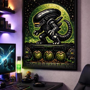 May include: Framed pixel art print featuring an Alien creature against a green moon backdrop with a starry sky. Below the alien are three green eggs. The artwork is displayed above a computer setup.