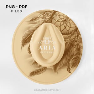 May include: A beige, circular design featuring a dreamcatcher and feathers. An oval-shaped object with the text "ARIA PATTERNS" is centered on the design. The words "PNG - PDF FILES" are at the top. The website address is at the bottom.