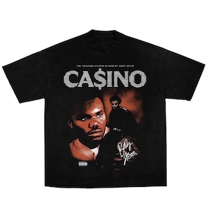 May include: A set of three ceramic mugs with a speckled, matte finish. The mugs are in shades of cream, light gray, and dark gray. Each mug has a simple, minimalist design, perfect for coffee or tea.