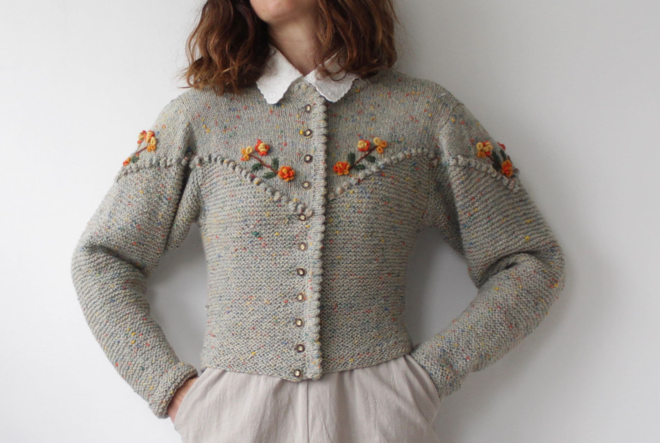 Vintage Austrian folk hand knit cardigan with floral corsages and bobbles