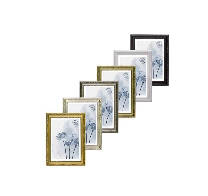 May include: A collection of framed art prints in various colors, including gold, silver, and black. Each frame has a decorative border and contains a watercolor-style floral design in shades of blue and white. The frames are arranged at an angle.