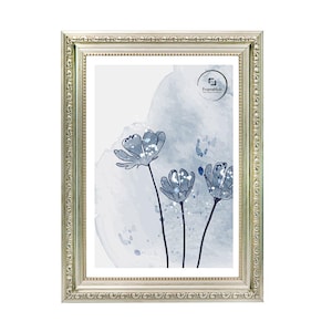 May include: A rectangular silver picture frame with ornate detailing surrounds a print of blue watercolor flowers. The artwork features three stylized flowers with dark stems against a light blue and white background. The FrameHub logo is visible.