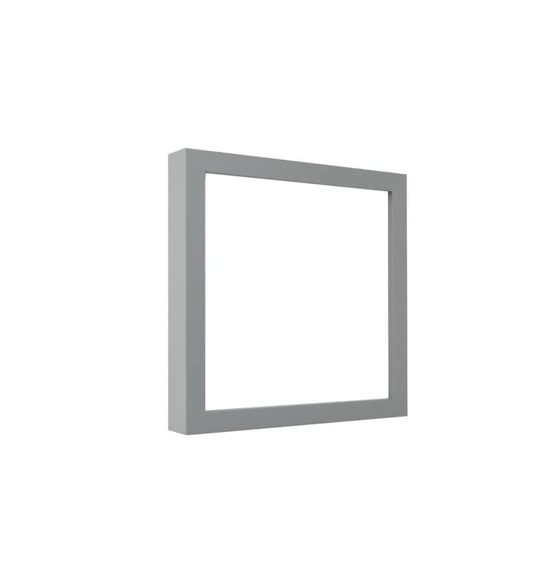 May include: A square, pale grey picture frame with a thick border. The frame is empty, with a white background visible through the opening. The frame is positioned on a white background.