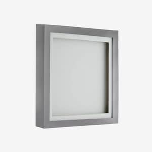 May include: A silver picture frame with a white mat. The frame is square and has a simple design.