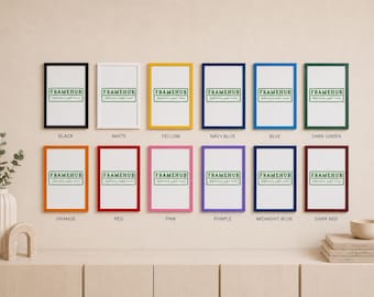 May include: A display of framed art prints in a range of colours: black, white, yellow, navy blue, blue, dark green, orange, red, pink, purple, midnight blue, and dark red. Each frame has a white interior and the text "FRAMEHUB".
