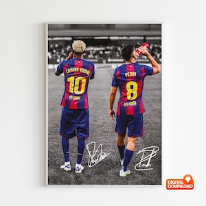 May include: A framed print featuring two soccer players in blue and red striped jerseys with gold numbers and names on the back. One player is drinking from a red water bottle. The print includes signatures and the words "DIGITAL DOWNLOAD".