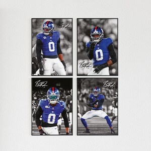 May include: Four framed prints featuring a football player in a blue uniform with the number 0. The player is wearing a helmet and is in various action poses. Each print has a black frame and a signature.