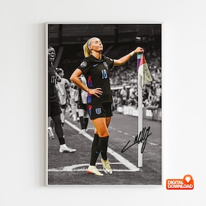 May include: Framed black and white print of a female soccer player in a black England kit, number 18, holding a corner flag. The image includes a signature and is set on a soccer pitch.