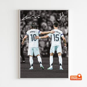 May include: Black and white digital download of a framed soccer poster. Two players in white jerseys with the numbers 10 and 15 are embracing. The poster includes signatures and a "DIGITAL DOWNLOAD" icon.