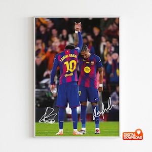 May include: A framed digital print featuring two soccer players in blue and maroon jerseys. One player raises their arm, displaying the number 10 on the back. The image includes signatures and a digital download icon.