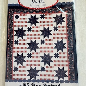 May include: A quilt pattern titled "#195 Star Striped" by Coriander Quilts. The design features navy blue stars and red and white stripes on a white background. The pattern is packaged in a clear plastic sleeve.