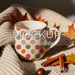 May include: A white ceramic mug with a fall leaf pattern, the text "MOCKUP for Procreate" is displayed on the mug. The mug is on a cream-colored knitted blanket, with cinnamon sticks and fall leaves.