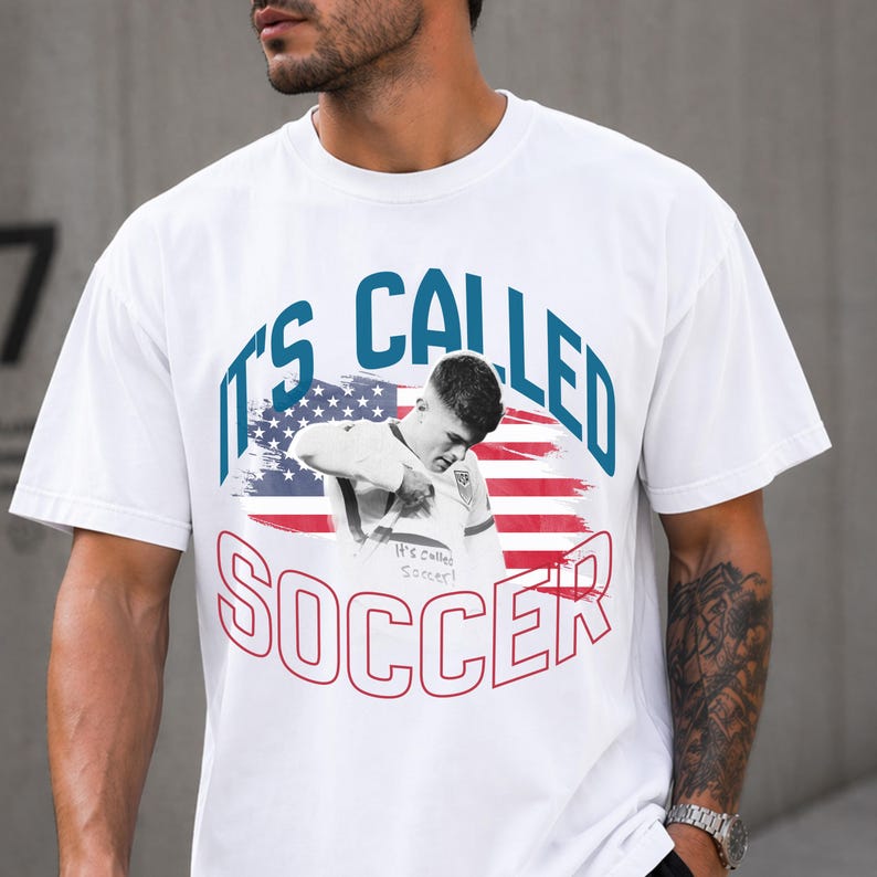 White USA soccer shirt 2026 with “It’s Called Soccer” graphic, American flag design, unisex fan tee