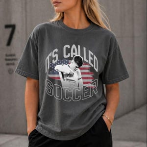 Vintage gray soccer shirt on female model, USA flag graphic tee, relaxed fit Comfort Colors style