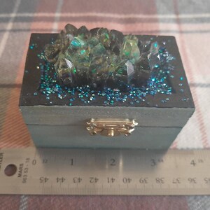 Trinket box shown next to a ruler to show its size.