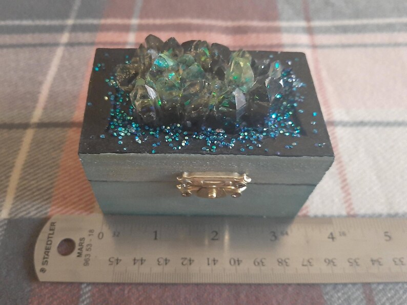 Trinket box shown next to a ruler to show its size.