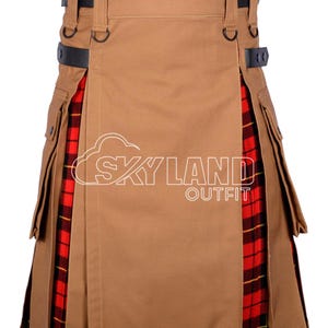 May include: A tan kilt with black leather straps and pockets. The kilt features a red and black plaid pattern on the pleats. The text "SKYLAND OUTFIT" is visible on the front.