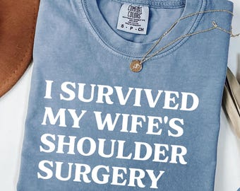 I Survived My Wife’s Shoulder Surgery Shirt, Funny Husband Gift, Shoulder Surgery Survivor Tee, Recovery Gift, Shoulder Replacement Humor