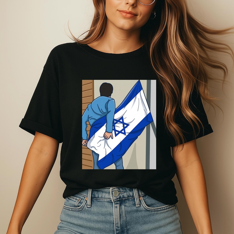 May include: Black t-shirt featuring a graphic of a person holding the Israeli flag. The flag is white with blue stripes and a blue Star of David. The person is wearing a blue suit.
