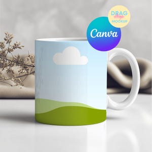 May include: White ceramic mug with a green grassy hill and a blue sky with a white cloud design. The mug has a white handle.