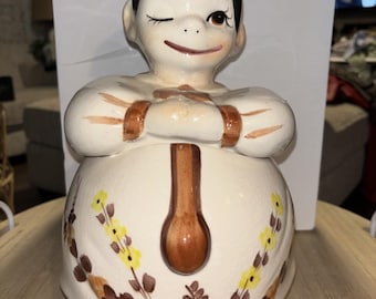 Tarro de cerámica para galletas con diseño de chef guiñando un ojo, estilo Acuario mexicano vintage.