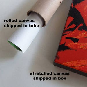 May include: A rolled canvas print is shown inside a cardboard tube. The text "rolled canvas shipped in tube" is written below the tube. A stretched canvas print is shown on a white surface with the text "stretched canvas shipped in box" written below the print.