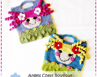 May include: Two crocheted bags featuring a girl's face design. The bags are blue and turquoise with green trim and colourful buttons. The girls have pink and yellow hair with flowers. The bags have a handle and are ideal for carrying small items. Angels Chest Boutique www.AngelsChest.Etsy.com