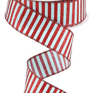 May include: Red and white striped ribbon with a glittery finish. The ribbon is 2.5 inches wide and is perfect for adding a festive touch to any craft project.