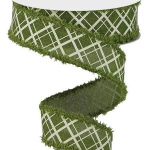 May include: Green and white plaid ribbon with a frayed edge. The ribbon is 2.5 inches wide and has a white plaid pattern on a green background.