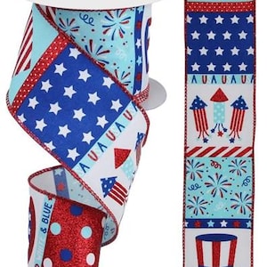 May include: A decorative ribbon roll featuring a patriotic design with red, white, and blue colors. The ribbon displays stars, stripes, fireworks, and a heart-shaped American flag. The words "RED WHITE & BLUE" are printed on the ribbon.