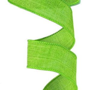 May include: A roll of lime green burlap ribbon with a textured weave. The ribbon is 2.5 inches wide and has a wired edge.
