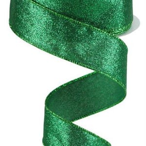May include: A roll of green glitter ribbon with a satin finish. The ribbon is 2.5 inches wide and has a wired edge.
