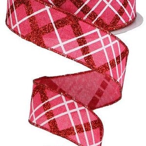 May include: Red and white plaid ribbon with a glittery red stripe. The ribbon is 2.5 inches wide.