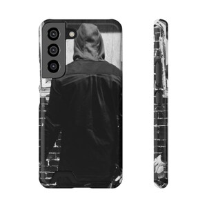 Funda para teléfono con tarjetero de estética urbana, color negro, elegante y funcional, ideal para él o ella, cumpleaños o Navidad. Estilo moderno.