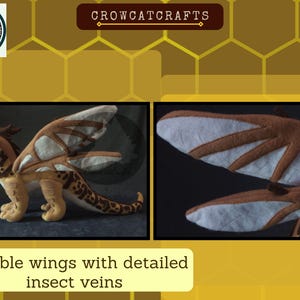 May include: A plush dragon toy with tan, brown, and white wings and body. The wings have detailed insect vein patterns. The dragon has a long tail with brown spots. The image also shows the text "Posable wings with detailed insect veins."