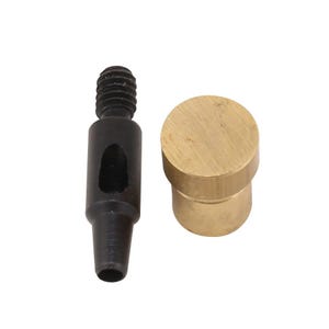 May include: Two-piece metal tool set. One piece is black with a threaded top and a tapered end. The other piece is a solid, cylindrical brass component. The tools are likely used for leatherworking or similar crafts.