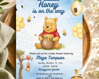 May include: A baby shower invitation card featuring a watercolor illustration of Winnie the Pooh holding a honey pot. The text reads A Little Honey is on the way, Maya Tompson, Saturday, November 14, 2026, 1:00 PM - 3:00 PM, Honeygumm Garden, 42 Headmone Lane, Brookfood, USA, RSVP at (555) 214-7856 flia.