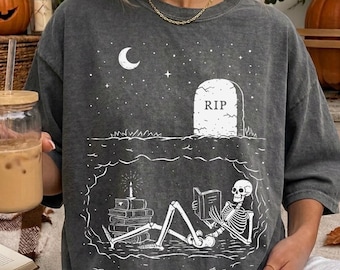 Comfort Colors® Read in Peace t-shirt, Skeleton Book Shirt, Skeleton Reading t-shirt, Book Lover Halloween, iprintasty Halloween