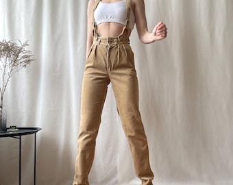 Pantaloni vintage in velluto a coste marrone plissettato con cinturini, vita alta e gamba dritta, taglia XS