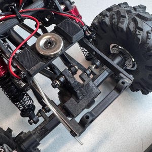 Hobbyplus Cr18 Evo Pro Juiced up rear link riser.
