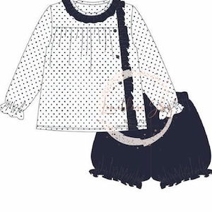May include: A white polka dot long-sleeve top and matching navy blue shorts set. The top features a navy blue ruffled collar and trim, with a button-up front and ruffled accents. The shorts have a ruffled hem.