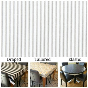 May include: Three tablecloths are shown, each with a different style: draped, tailored, and elastic. The draped tablecloth is black and white striped, the tailored tablecloth is floral, and the elastic tablecloth is black with white polka dots.