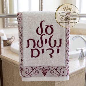 May include: A rustic wooden sign with the text "Welcome to our home" in white lettering. The sign has a distressed finish and a simple, inviting design, ideal for entryway decor.