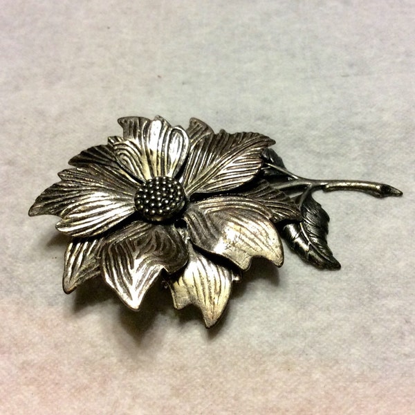 Vintage 1960's silver metal flower repousse brooch pin.