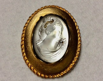 Glass bejewelled repousse cameo brooch pin.