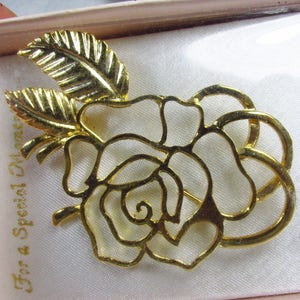 Vintage new in box gold metal rose with leaves brooch pin.