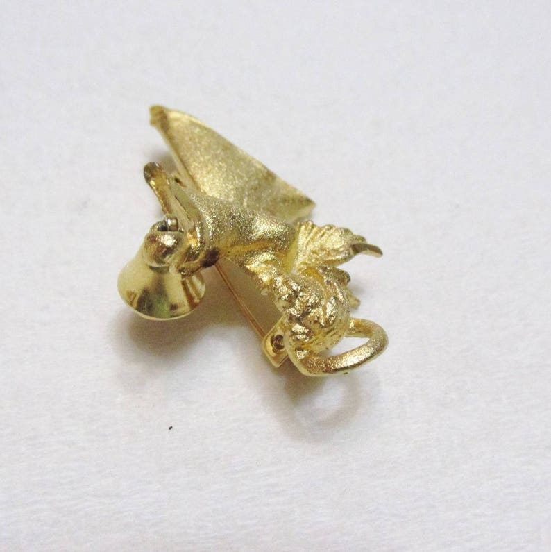 vintage 1970s gold toned metal angel with bell brooch pin