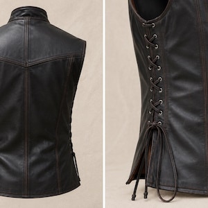 May include: A dark brown leather vest with a stand-up collar and decorative stitching. The vest has a lace-up closure on the sides and a button-up front. The leather has a distressed appearance.