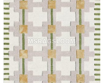 May include: A rectangular rug with a geometric pattern. The design features a white background with gray, green, and gold accents. The text "MSRAGSLOOM" is visible. The rug has a repeating pattern of squares and lines.
