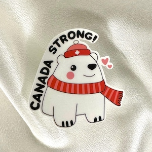 Bonita pegatina de vinilo de oso polar canadiense de invierno fuerte. Ideal para laptop, equipaje, funda de teléfono, auto, agenda y botella de agua.